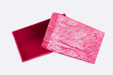Blank pink gift box. Top view on luxury pink box isolated on white background.
