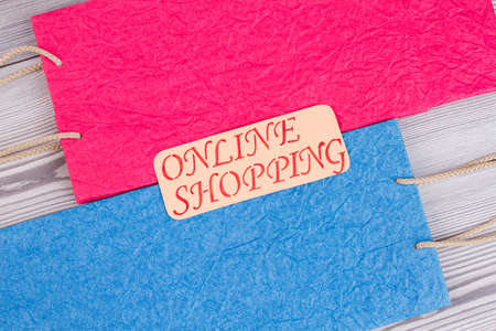 Online shopping inscription on paper bags. Internet shopping concept.の写真素材