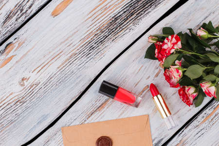 Female accessires, flowers, and post mail. Top view, flat lay. White wood background.の写真素材