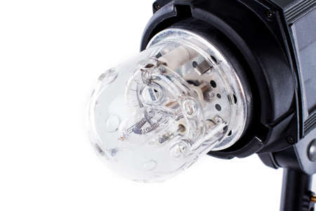 Studio photo flash strobe head close up. Detail of photography flash strobe light. Isolated on white...