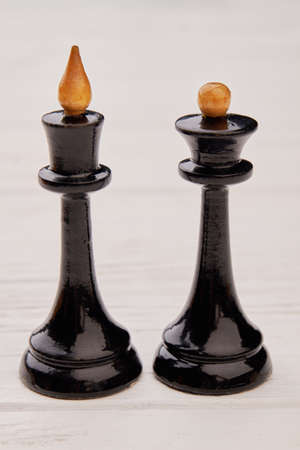 Chess figures isolated on white background. Two black chess queen and king. Chess game concept.の写真素材
