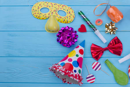 Colorful Birthday decorations on wooden background. Birthday party supplies with copy space. Concept of childrens Birthday party.の写真素材