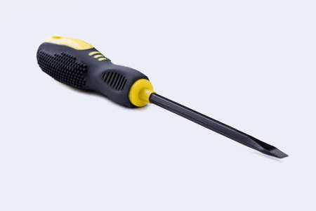 Screwdriver isolated on white background. Building instrument, horizontal image. Tool for repairman.