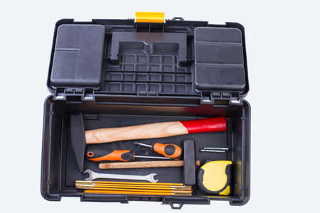 Construction tools box. Mechanic tools set in box. Isolated on white background.