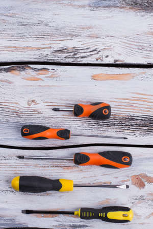 Set of various screwdrivers on wooden background. A new set of screwdrivers on wooden boards. Top view and copy space.の写真素材