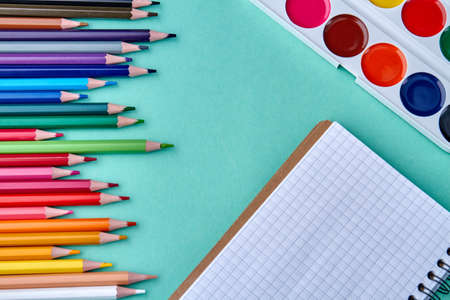 Watercolor palette, sketchbook and multicolored pencils. Art and creativity. Kids hobby concept.の写真素材