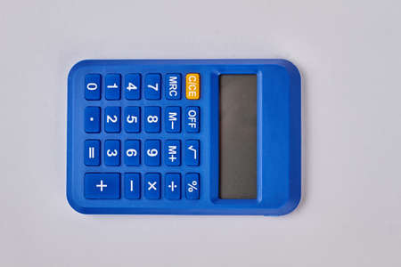 Blue digital calculator on white background. Small electronic device.