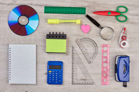 Back to school background. Stationery, office and student accessories on wooden background.