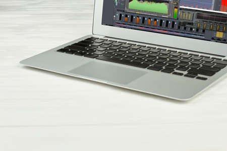 Silver laptop on white surface. Opened pc notebook with blank screen on white background. Modern...