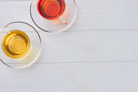 Tea in cups on white wooden background. Two cups of tea and copy space. Horizontal image.の写真素材
