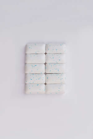 Chewing gums on white background, top view. Chewing gum pieces on white background. Refresh your breath.の写真素材