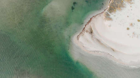 Aerial view of water surface by drone. Top view of beautiful beach and sea. Amazing natural...