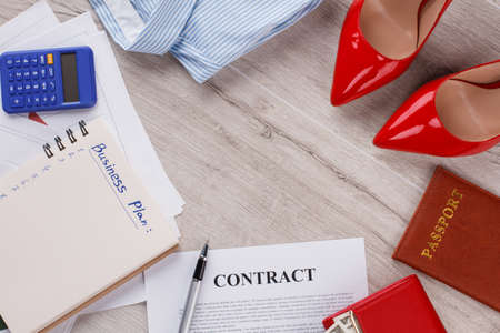 Heels, contract and business plan. Office lady ready for working day. Business trip soon.の写真素材