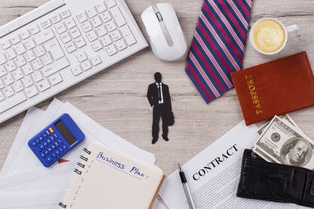 Successful accountans table. Cappuccino, passport and money. Long road after coffee break.の写真素材