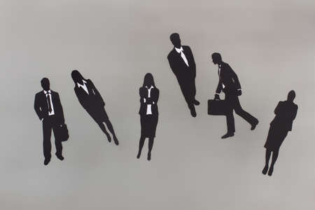 Black paper figures of buisness people. Business collegues. Office team.の写真素材