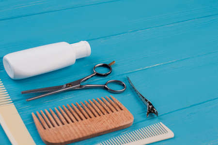 Professional hairdresser set for men. Combs, scissors and shampoo. Space for text.