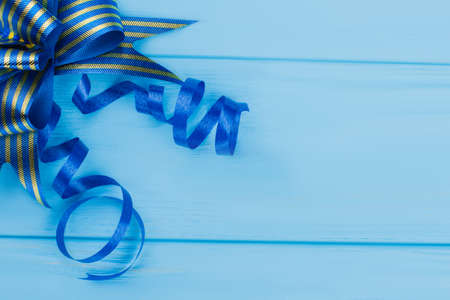 Blue bow gift ribbon, close up. Top view. Copyspace.の写真素材