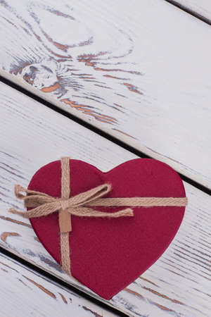 Color gift box in a shape of heart. Red heart shaped gift box with copy space. Symbol of love.の写真素材