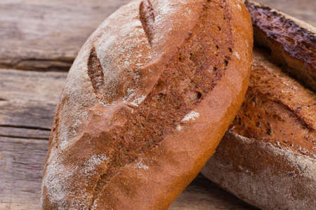 Close up of fresh wheat bread. Two loaves of natural homemade bread with crust. Healthy eating...