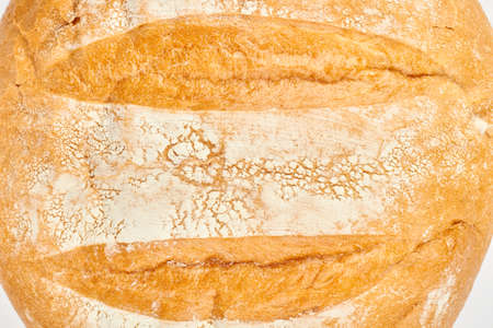 Close up of freshly baked wheat bread. Detail of healthy homemade bread. Delicious homemade food.の写真素材