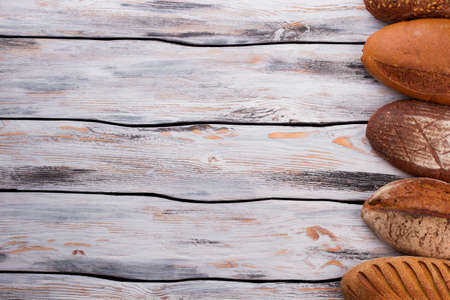 Bread on wooden boards and copy space. Natural healthy bread. Space for text.