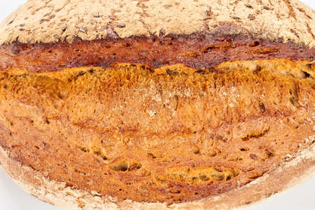Close up view of fresh bread with seeds. Detail of crispy homemade bread. Delicious natural food.