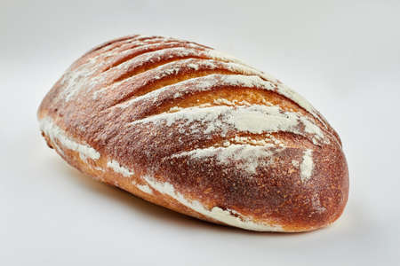 Gluten-free bread on white background. Loaf of healthy bread. Tasty homemade food.の写真素材