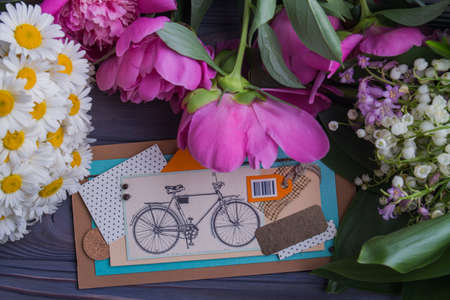 Flowers presents for holiday celebration. Abstract collage postcard, peonies, chamomiles, lillies and orchid bouquets.の写真素材