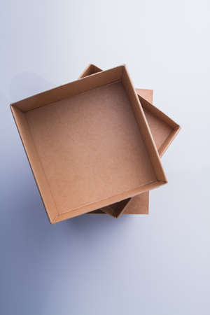 Stack of three cardboard boxes, top view. Column of beige carton conatiners.の写真素材
