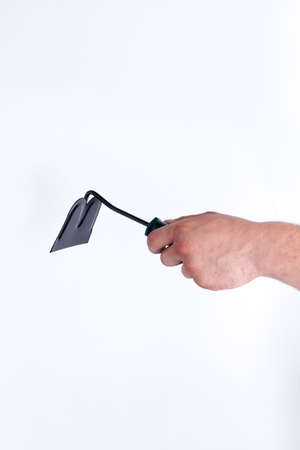 Handed field and garden hoe. White isolated background.の写真素材