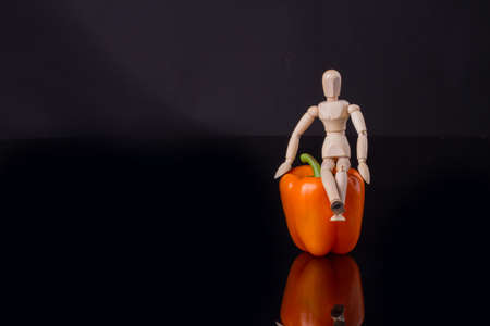 Mannequin on capsicum annuum. Creative idea.の写真素材