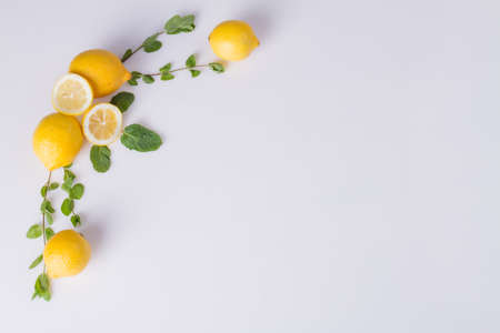 Aesthetic lemon flatlay. Beautiful set made of sprigs and citric halves. Decor concept.の写真素材