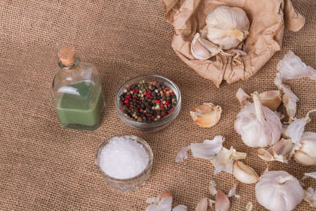 Garlic, black pepper, salt and oil. Spices and herbs for food cooking. Garlic benefits for health.