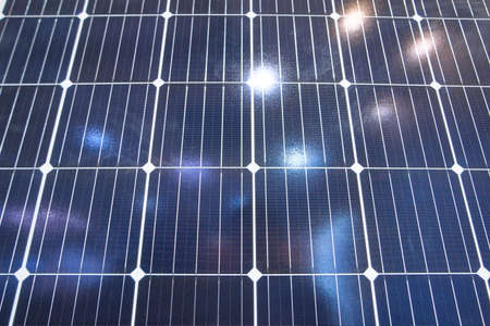 Blue solar panel surface. Sunshine reflection.