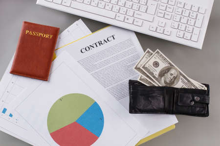 Contract and passport top view. Trip to beneficial contract. Business concept.の写真素材