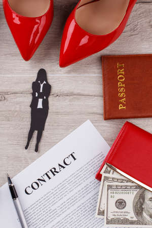 Money, contract and shoes. Budget of a successful lady. Office concept.の写真素材
