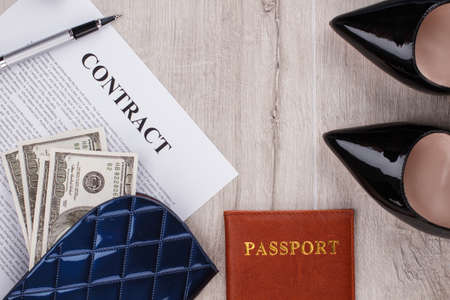 Contract, pen and wallet with american dollars. Businesswoman on the way to promotion. Business concept.の写真素材