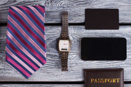 Watch, tie and smartphone. Businessman in details. Business concept.