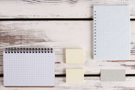 Paper stationery on wooden surface. Office geometry.の写真素材