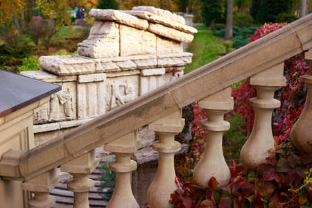 Granite railing close up. Decorative stairs.