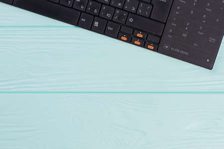 Modern computer keyboard on light blue background. Cyrillic alphabet keyboard layout set.の写真素材