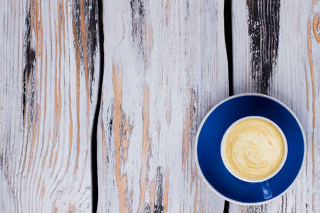 Flat lay coffee cup on wood and free space for text. Topview wooden table surface.の写真素材