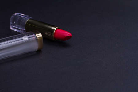 Wine lipstick on black table. Close-up photo. Women cosmetics for every day.の写真素材