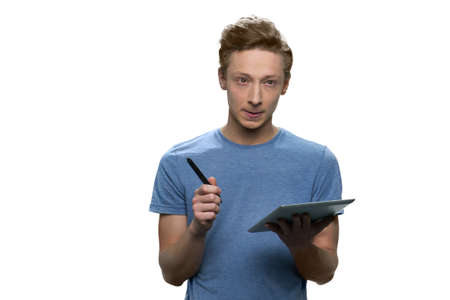 Teen stundent with tablet pc and pen. Isolated on white background.の写真素材