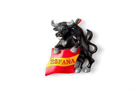 Tourist souvenir of bull with spain flag. Isolated on white background.の写真素材