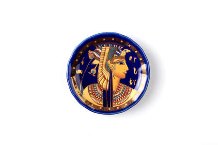 Plate with ancient egyptian god image. Isolated on white background.の写真素材