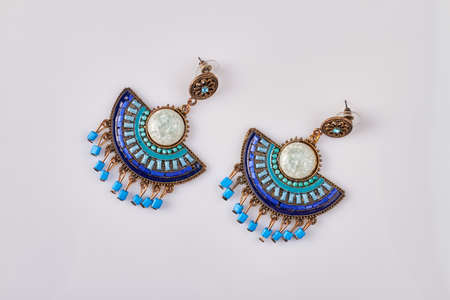 Beautiful decorative earrings. Isolated on white background.