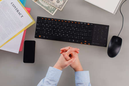 Business woman working at office close up. Flat lay workspace with femal hands, computer keyboard,...