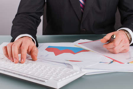 Businessman working investment project on laptop computer. Businessman working with computer and...