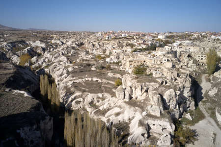 Top view of Ortahisar town old houses. Natural volcanic rocks with ancient cave houses in Cappadocia, Turkey. Architecture of old historical city.の写真素材
